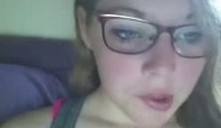 Lewd nerdy serious looking webcam gal bragged of her big boobies