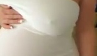 Wondrous webcam preggo brags of her swollen boobies and big belly